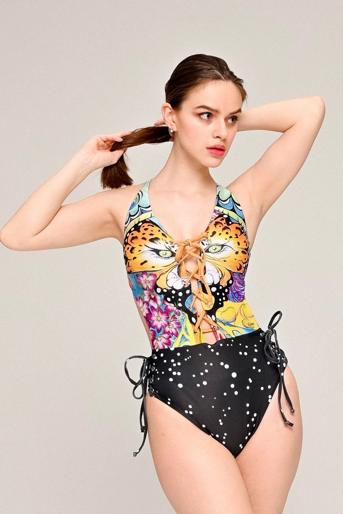 Deep neck lacing, stretchy strings all around 'Dotted Tiger' swimwear