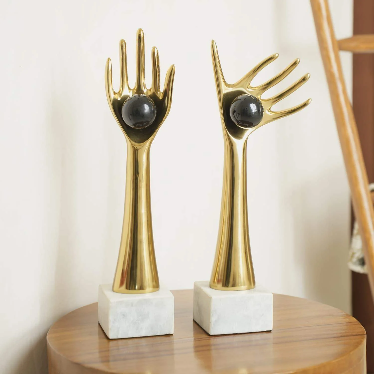 The Golden auspicious hands holding balls in aluminum set of 2